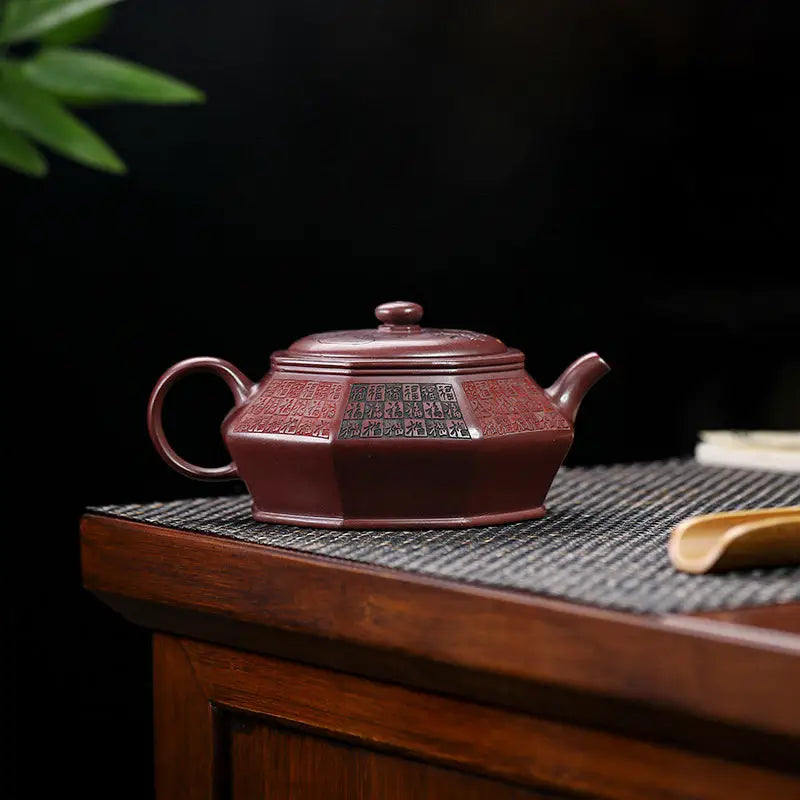 Maroon octagonal teapot with Chinese seal script, HexaSeal Yixing Zisha craftsmanship