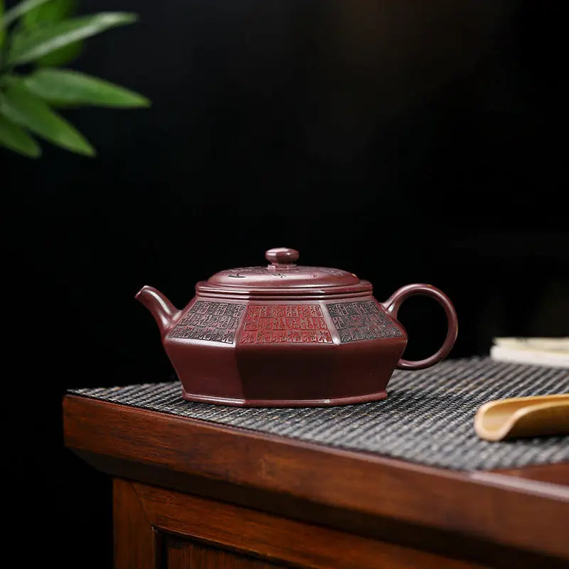 Octagonal maroon teapot from HexaSeal Yixing with Chinese seal script design