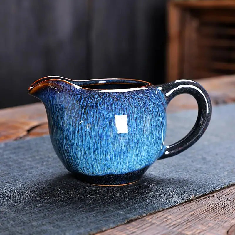 Blue ceramic creamer with handle from Iceberg Tea Set, handcrafted Jian Zhan teaware