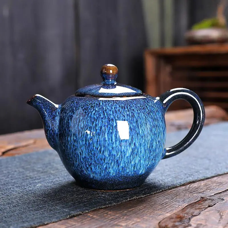 Blue ceramic teapot from the Iceberg Tea Set, part of the handcrafted Jian Zhan teaware collection