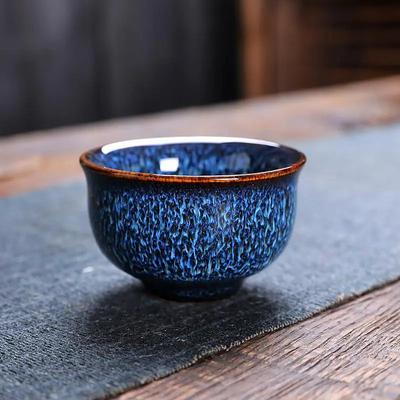 Blue speckled ceramic teacup from Iceberg Tea Set, part of handcrafted Jian Zhan teaware