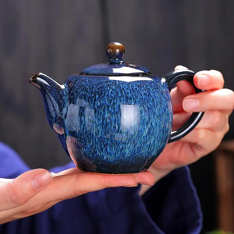 Blue glazed ceramic teapot from the Iceberg Tea Set, a handcrafted Jian Zhan teaware piece