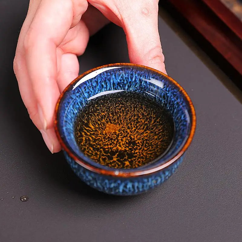 Blue and brown ceramic teacup from Iceberg Tea Set, handcrafted Jian Zhan teaware