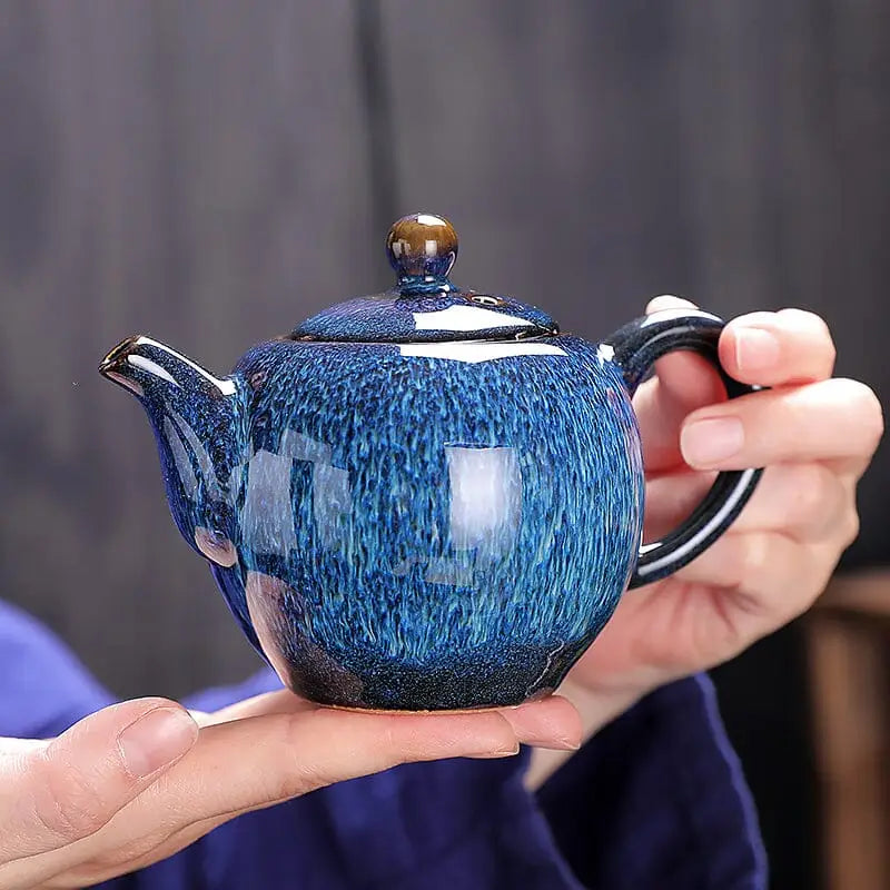 Blue glazed ceramic Iceberg Teapot showcasing Jian Ware style from Jian Zhan collection