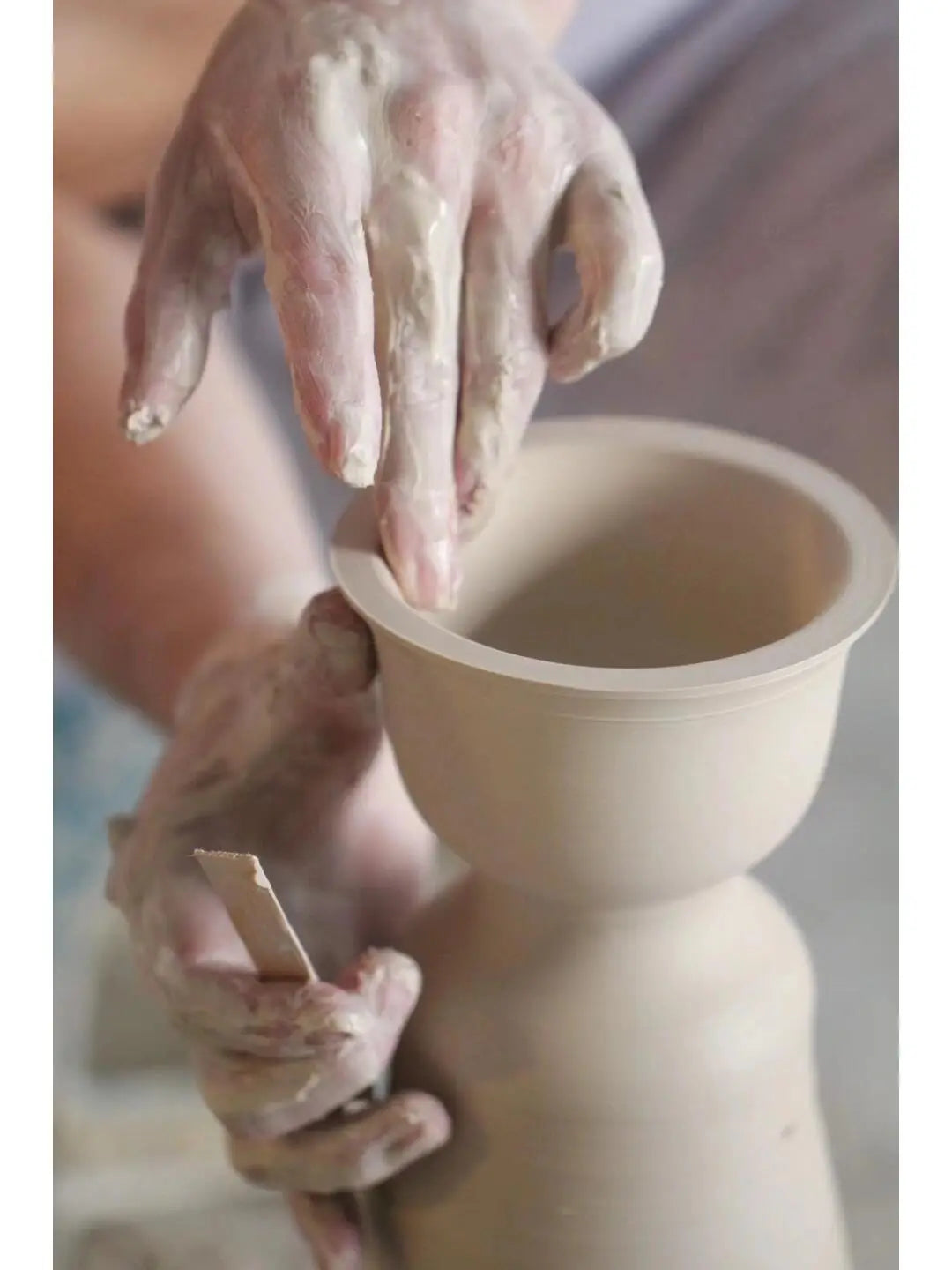 Clay pottery being shaped on a wheel showcasing Dehua porcelain craftsmanship in Fujian Province