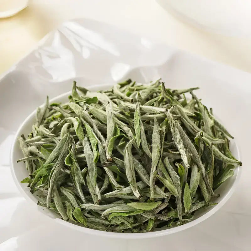 Bowl of dried White Tea leaves showcasing Imperial Baihao Yinzhen Silver Needle Tea 2025
