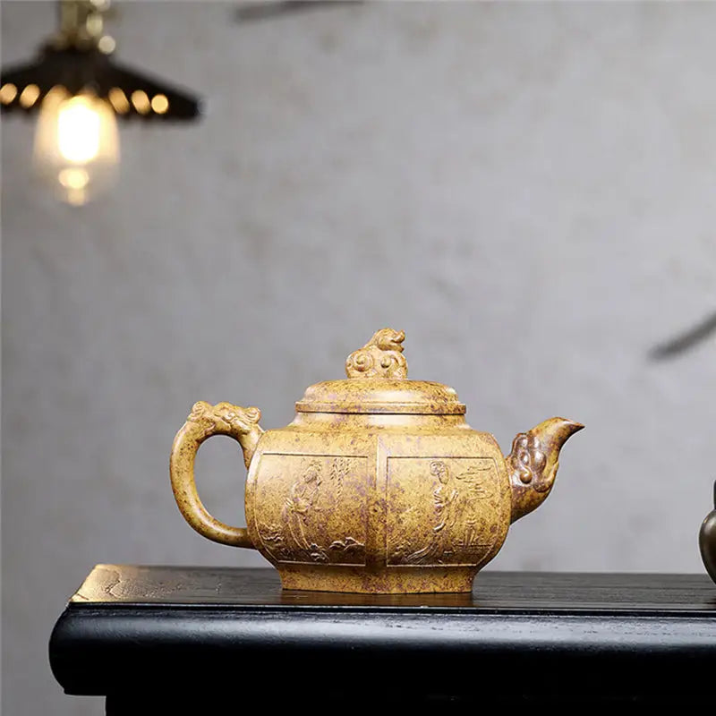 Ornate tan-colored teapot in Imperial Gate style made from Yixing Duanni Duanni clay