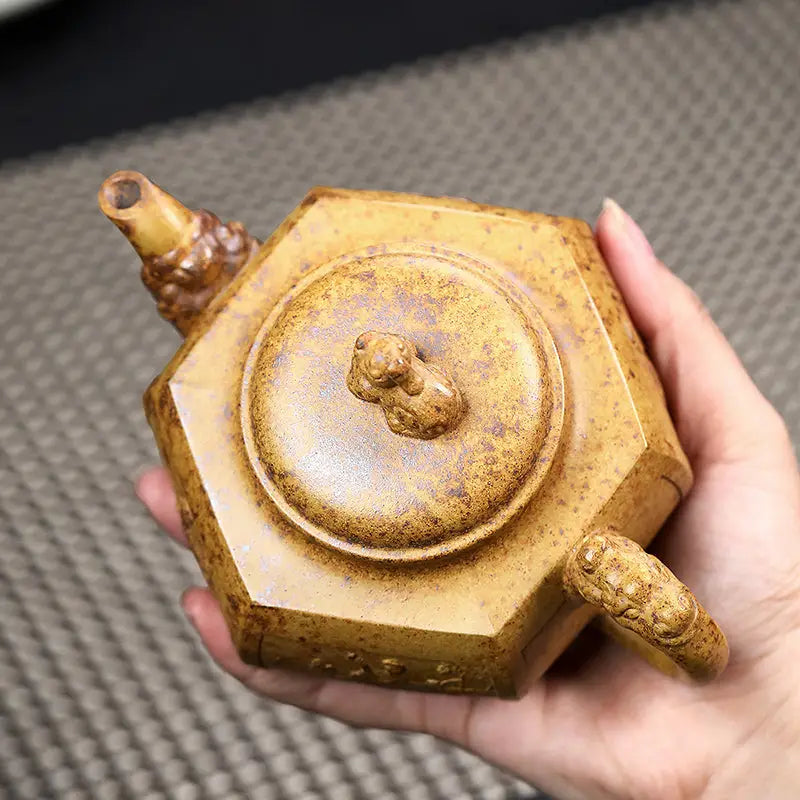 Hexagonal brown teapot made from Yixing Duanni clay in the Imperial Gate collection