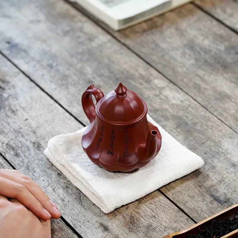 Reddish-brown Imperial Lotus Yixing Zisha Teapot with rounded body and pointed lid