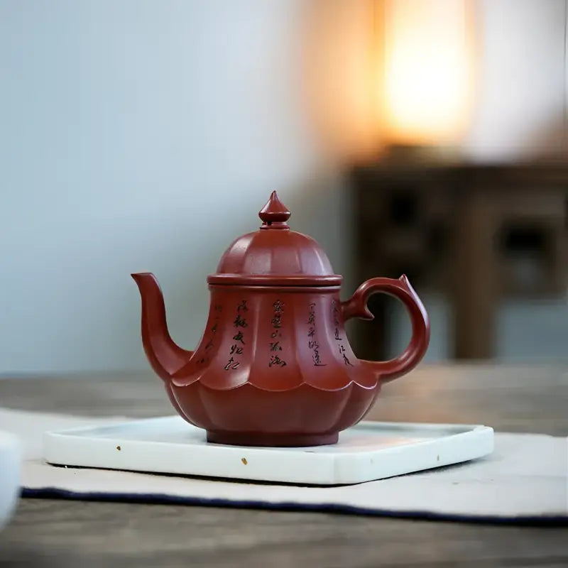 Reddish-brown Imperial Lotus Yixing Zisha teapot with inscriptions for authentic tea brewing