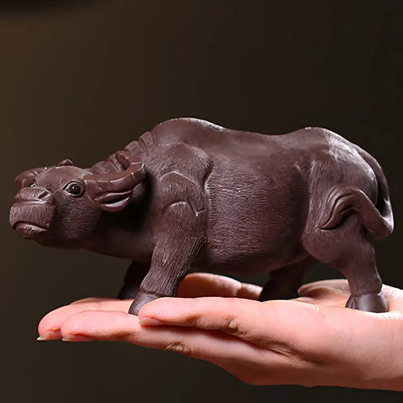 Brown water buffalo figurine from Ironhoof Guardian tea pet guide, perfect for water buffalo tea decor