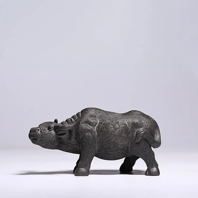 Dark carved Water Buffalo figurine from Ironhoof Guardian tea pet guide for water buffalo tea