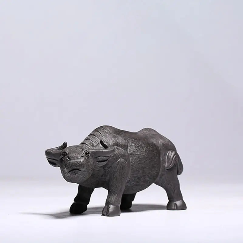 Dark carved water buffalo figurine from Ironhoof Guardian tea pet guide for water buffalo tea