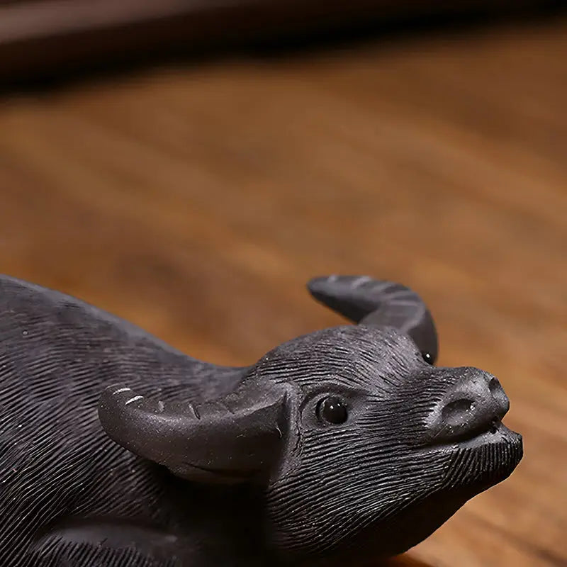 Dark textured Buffalo figurine from Ironhoof Guardian tea pet guide for water buffalo tea enthusiasts