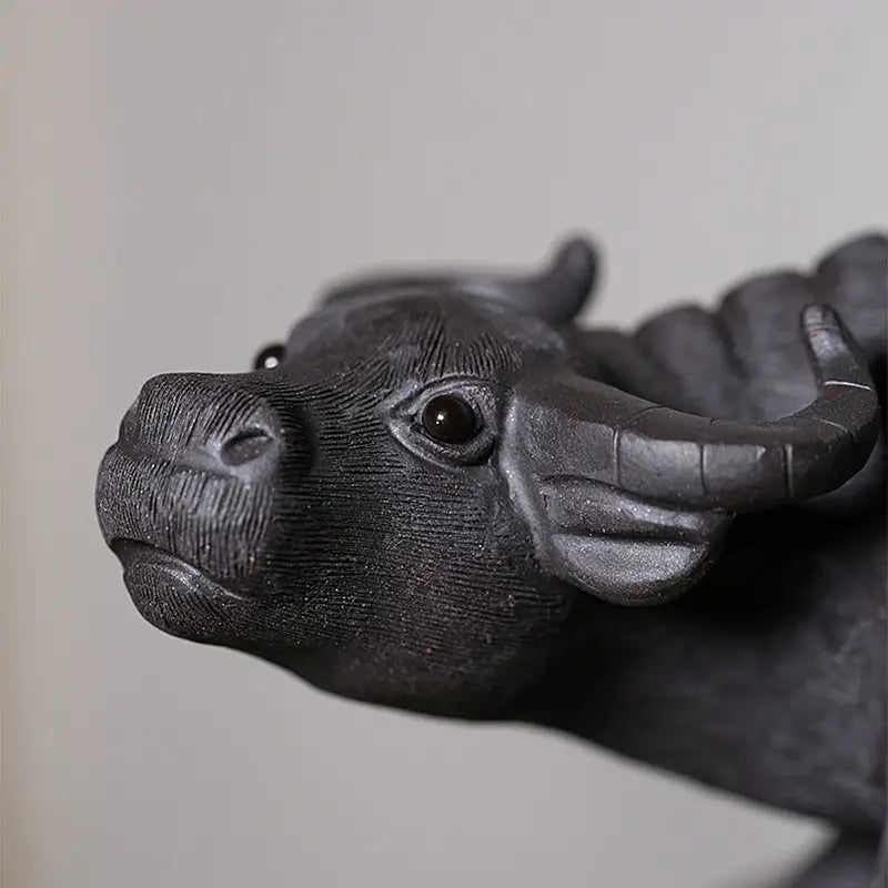 Black water buffalo sculpture from Ironhoof Guardian, ideal for water buffalo tea tea pet guide