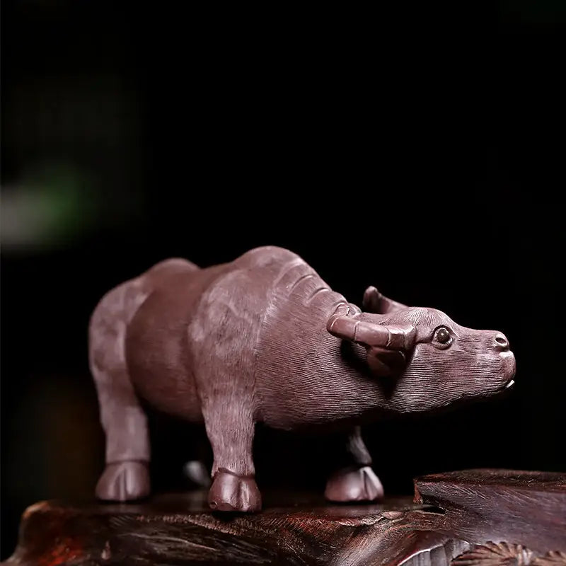 Carved wooden water buffalo representing Ironhoof Guardian tea pet for water buffalo tea guide
