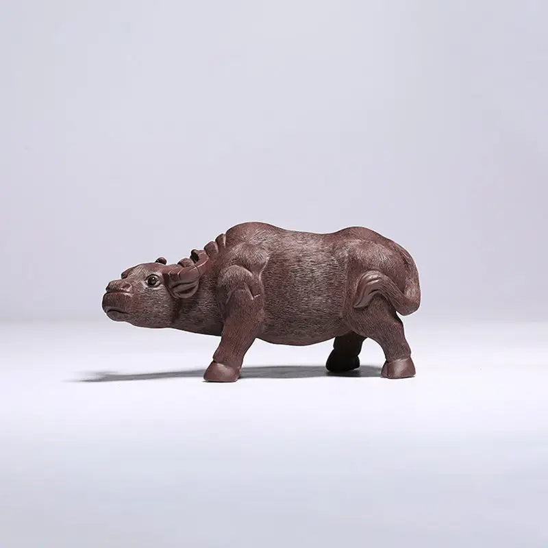 Brown water buffalo figurine from Ironhoof Guardian tea pet guide for water buffalo tea fans