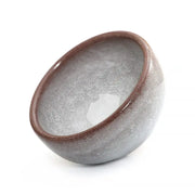 Glazed ceramic bowl with crackle pattern from Ivory Rift featuring crackled grape teacup design