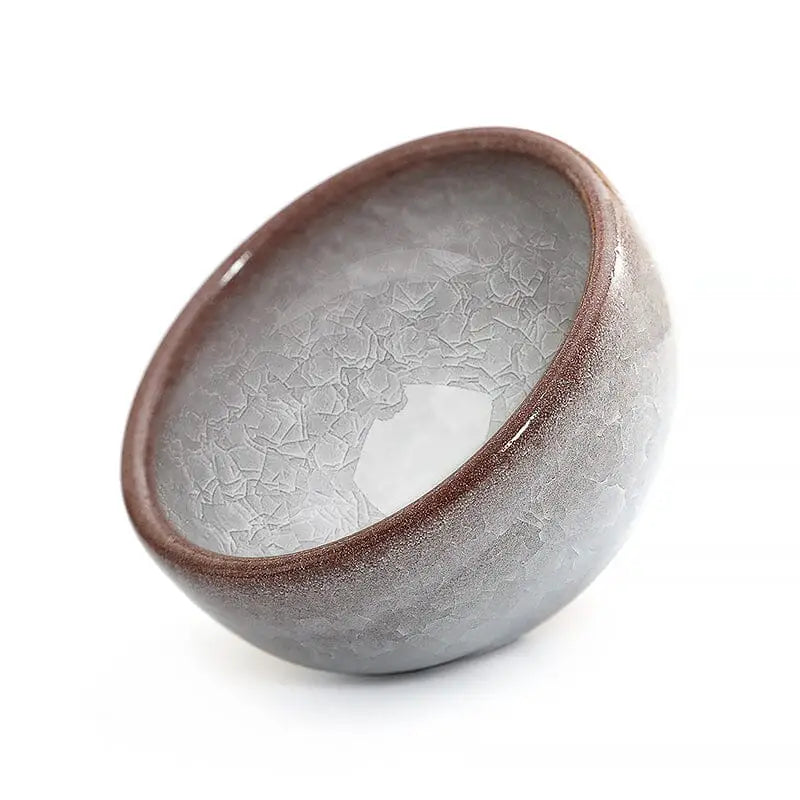 Glazed ceramic bowl with crackle pattern from Ivory Rift featuring crackled grape teacup design