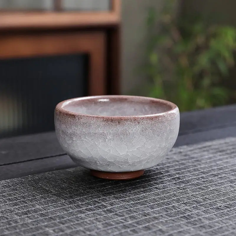 Ivory Rift crackled ceramic teacup with crackled grape glaze showcasing rift crackled glaze