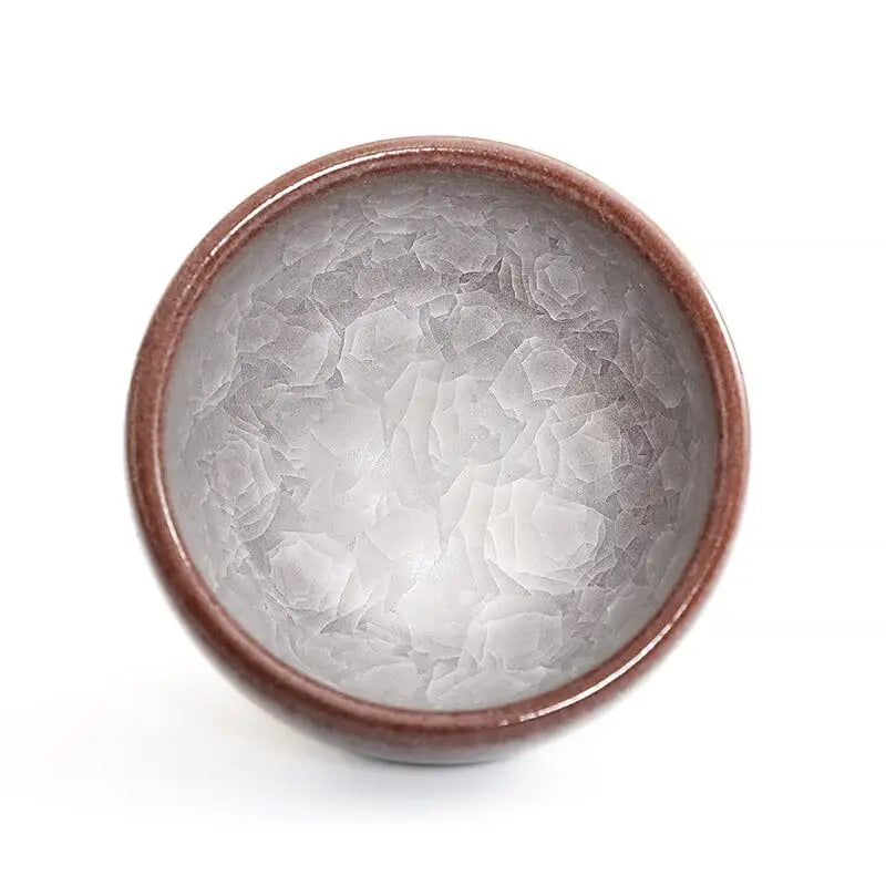 Ceramic bowl with ivory rift crackled glaze in the Ivory Rift collection, showcasing crackled grape teacup style