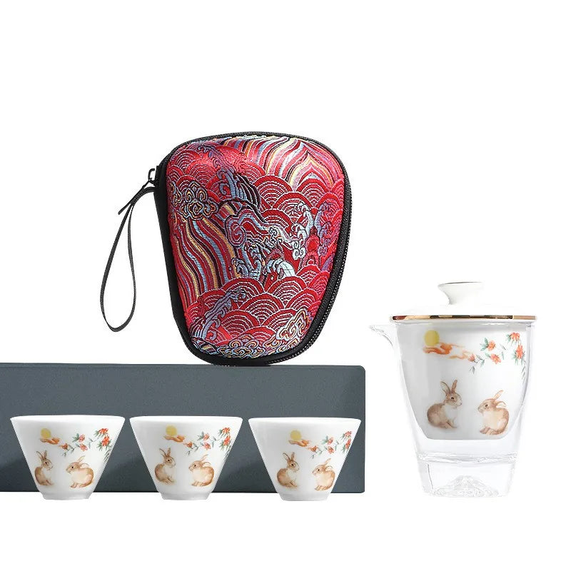 Jade rabbit white porcelain travel tea set with glass pitcher, three cups and red case – photo 1