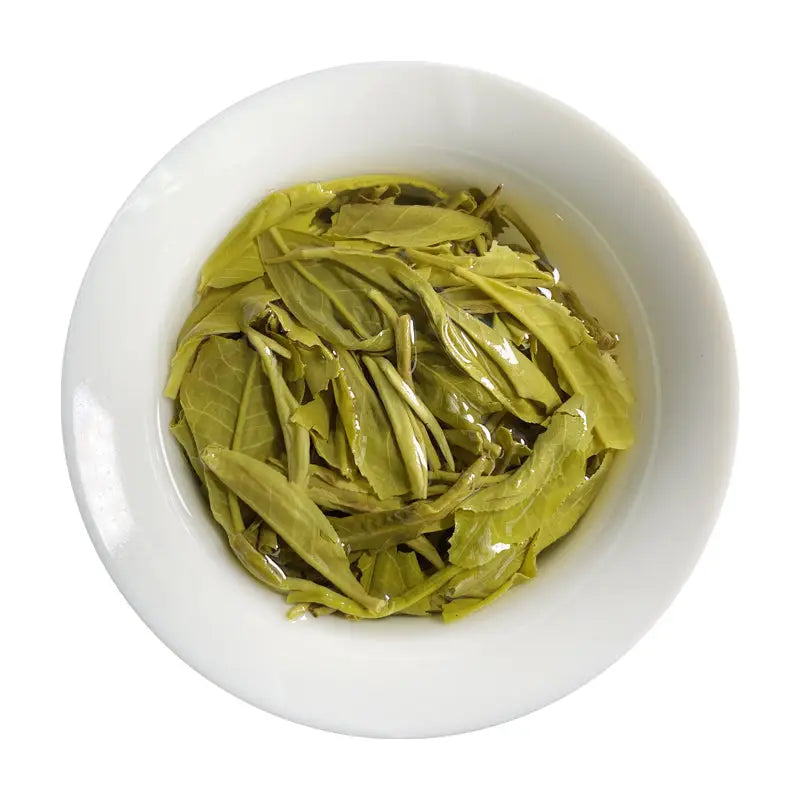 Bowl of steeped green tea leaves for Jasmine Tea Leave in teapots, tea sets, and mugs