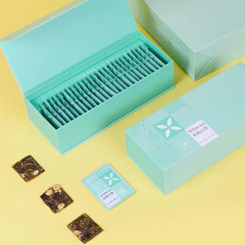 Mint-colored tea box set for Jasmine White Tea Leaves with teapots and mugs