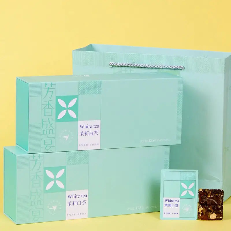 Mint-green tea gift set with Jasmine White Tea Leaves featuring teapots and mugs
