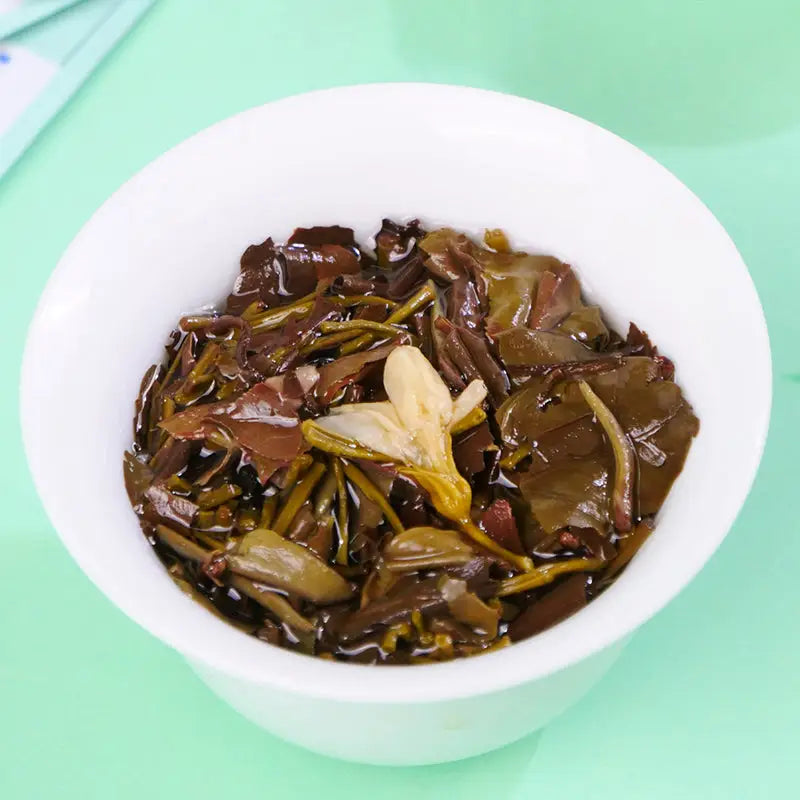 Infused Jasmine White Tea Leaves in a White Bowl for Tea Sets and Mugs