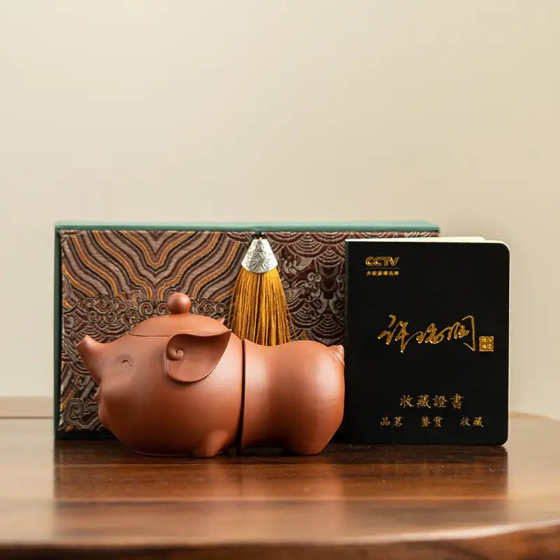 Pig-shaped brown ceramic teapot from the Joyful Piglet Tea Set, Yixing Zisha style