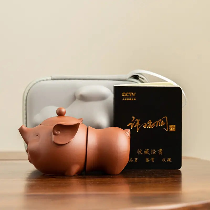 Joyful Piglet teapot set featuring a pig-shaped brown Yixing Zisha teapot
