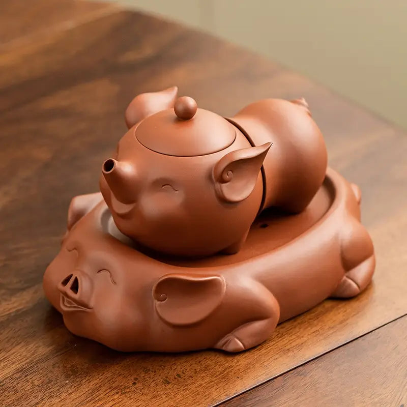 Joyful Piglet ceramic teapot set featuring pig-shaped Yixing Zisha teapots