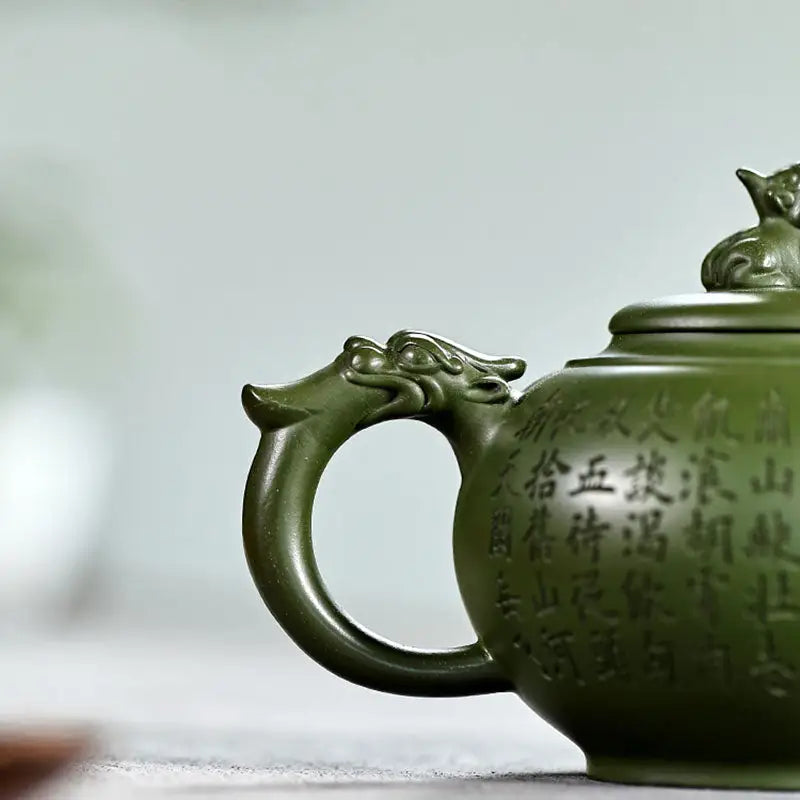 Green ceramic teapot with dragon handle from Kirin & Dragon featuring jianshui Zitao purple pottery teapots