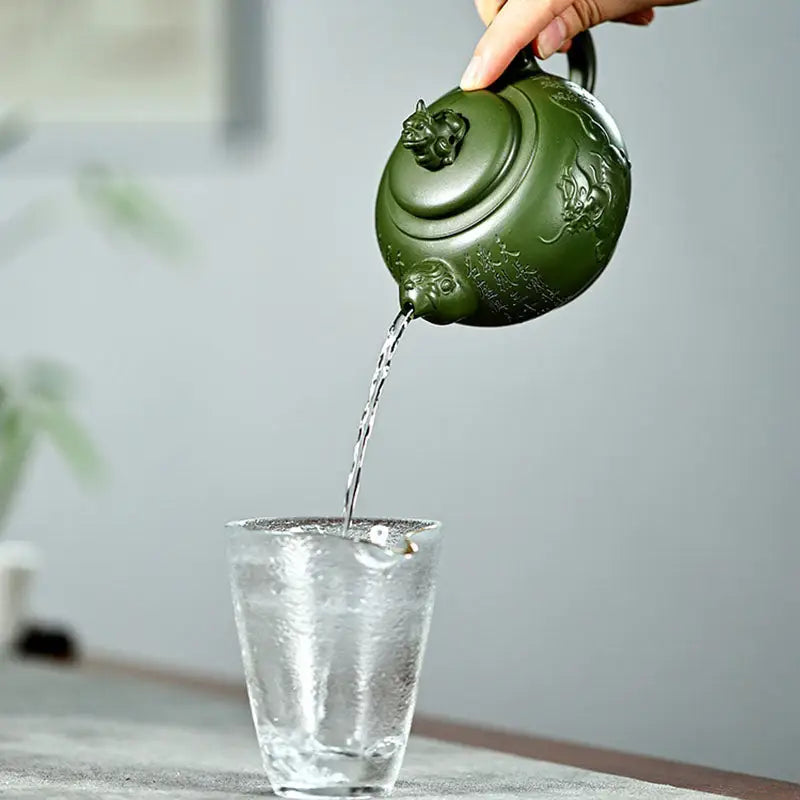 Green dragon teapot pouring water from Kirin & Dragon in jianshui zitao purple pottery teapots