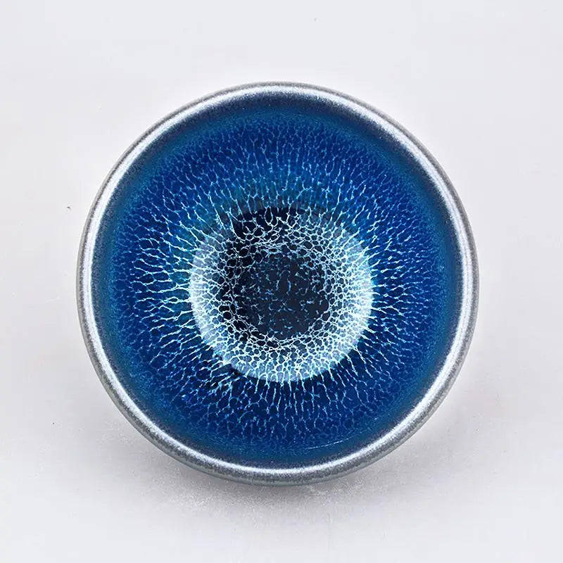 Blue ceramic teacup with crackle glaze from Laser Jian Zhan in Tenmoku tradition for tea moments