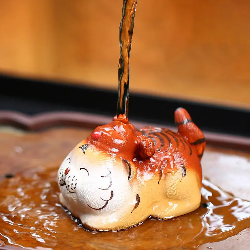 Ceramic Laughing Fortune Tiger tea pet in Zisha clay figurine style for tea pet guide