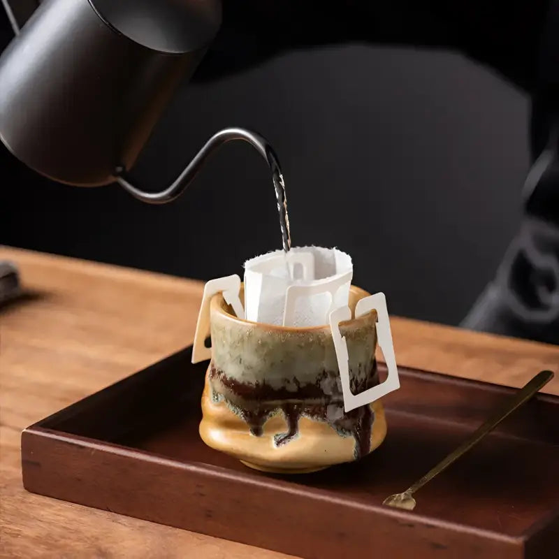 Lava Whisper pour-over coffee setup with ceramic coffee cup and ceramic coffee accessory