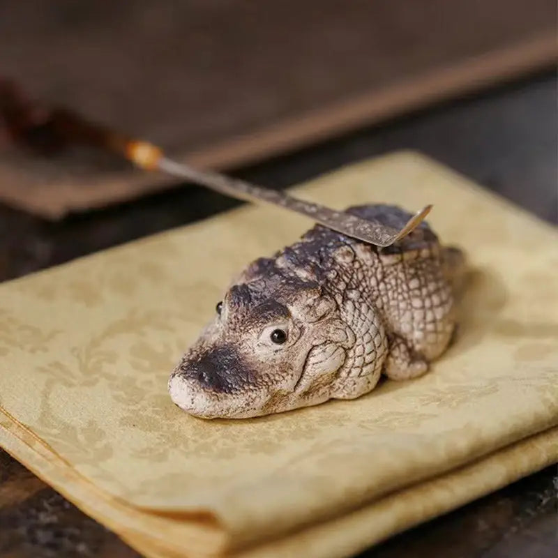 Ceramic crocodile tea pet made from Yixing Zisha Clay with spatula, ideal for feng shui