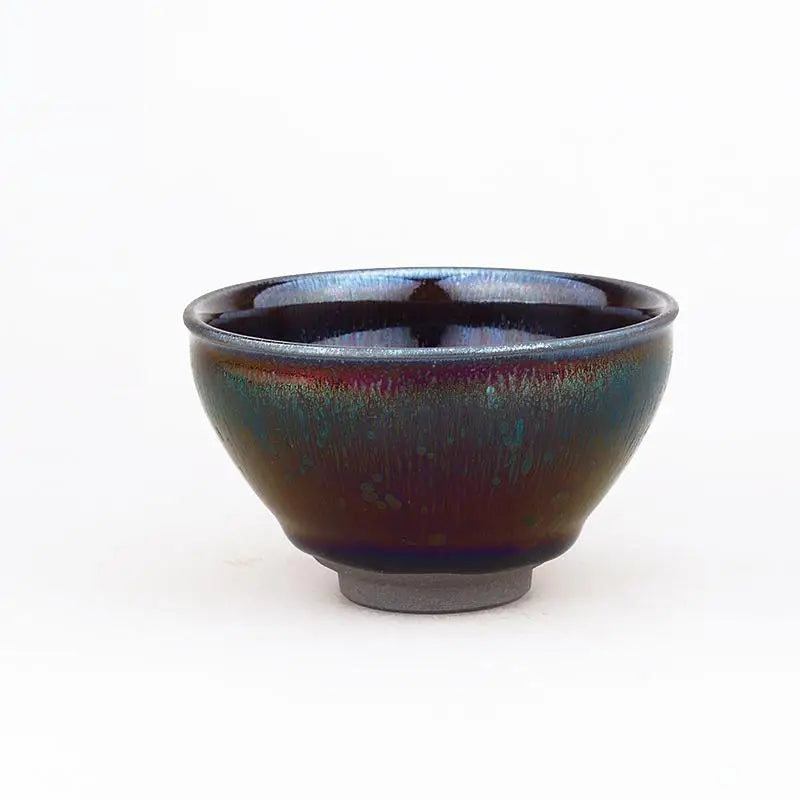 Iridescent ceramic bowl with tenmoku glaze from Lens, featuring deep violet hues