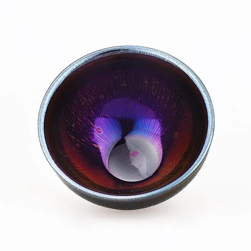 Iridescent purple and red bowl with tenmoku glaze, seen in the Lens Jian Zhan Teacup collection