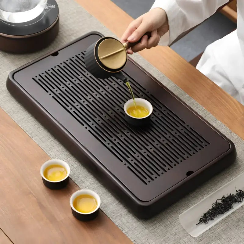 Dark brown Linear Harmony bamboo tea tray with slotted surface for elegant tea serving