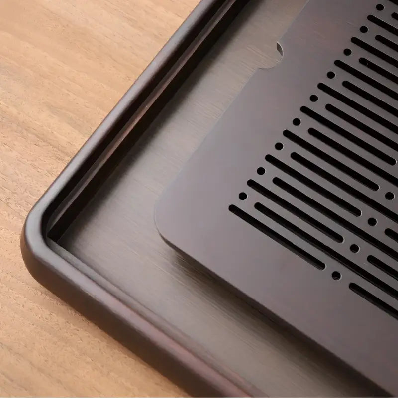 Dark brown linear harmony bamboo tea tray with slotted insert for elegant tea serving