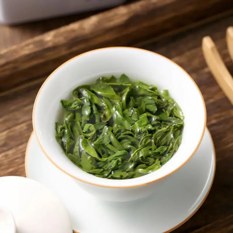 Cup of steeped green tea with ginkgo from Liu An Gua Pian in Red Stone Valley