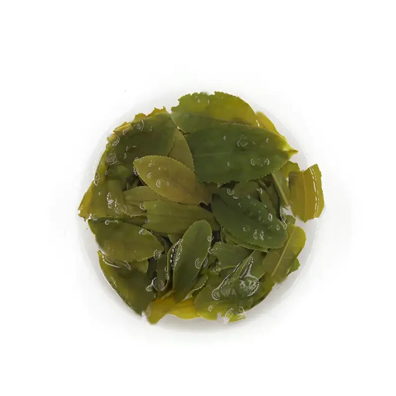 Green tea leaves from Liu An Gua Pian Red Stone Valley showcasing roasted Gua Pian leaves