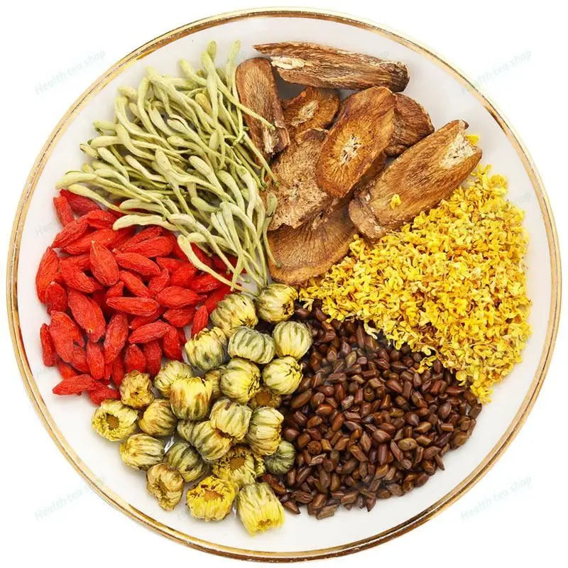 Assorted dried medicinal herbs on a plate for Liver Detox and abdominal fat reduction Vital Tea