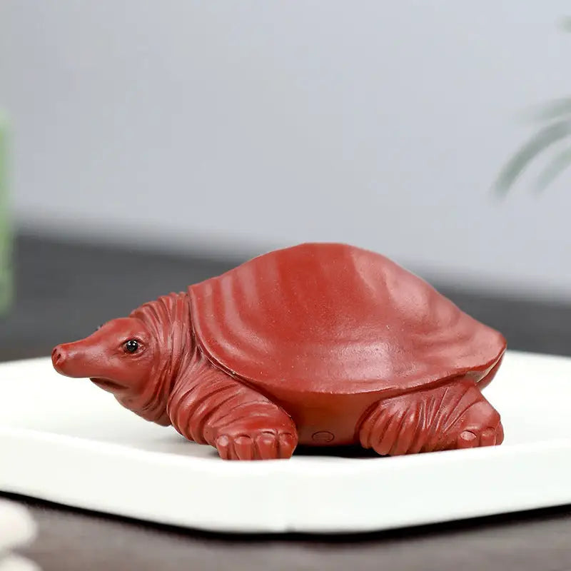 Reddish-brown Longevity Turtle tea pet made of Yixing Zisha clay showcasing water element design