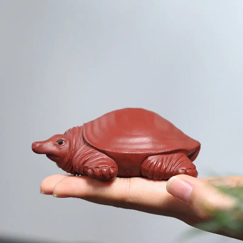 Reddish-brown longevity turtle tea pet made from Yixing Zisha clay, water element tea pets