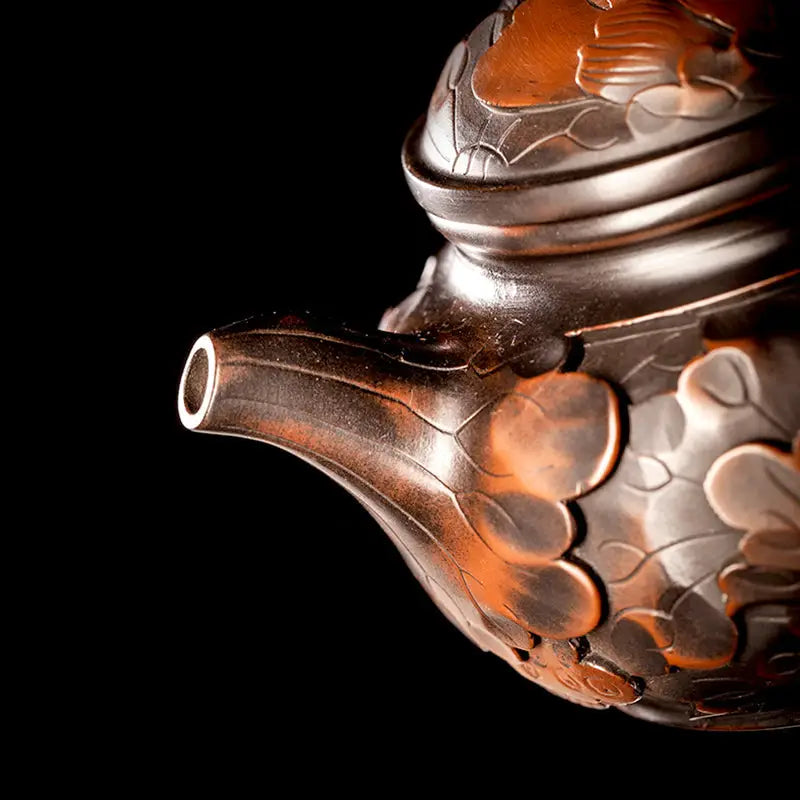 Ornate brown teapot spout from Lotus Flower Jianshui hand-carved lotus for gongfu tea enthusiasts
