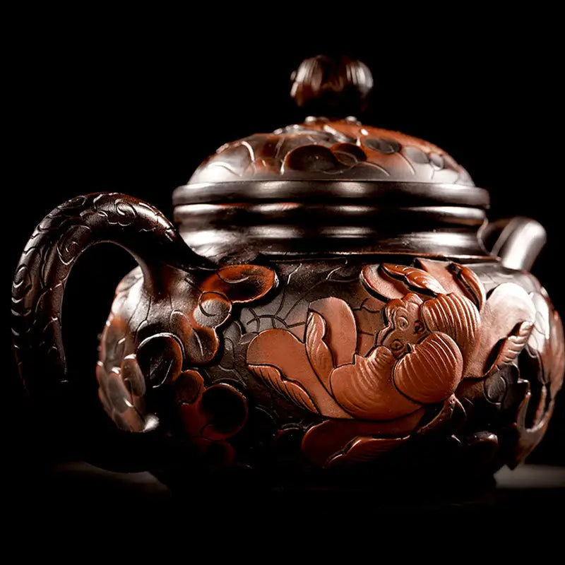 Ornate dark-brown floral-carved teapot from Lotus Flower Jianshui collection for gongfu tea enthusiasts